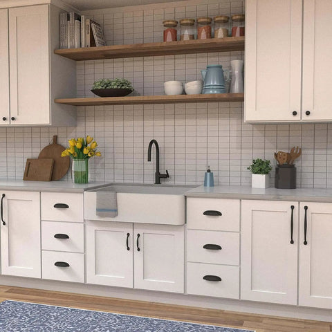Modern kitchen with white cabinets featuring Solid Core Black Iron Cabinet Knobs For Kitchen And Dresser, One And One Quarter Inch Heavy Duty Metal Pulls For Doors And Drawers, Boss Level Refined Rustic Collection By Hickory Hardware, One Pack.