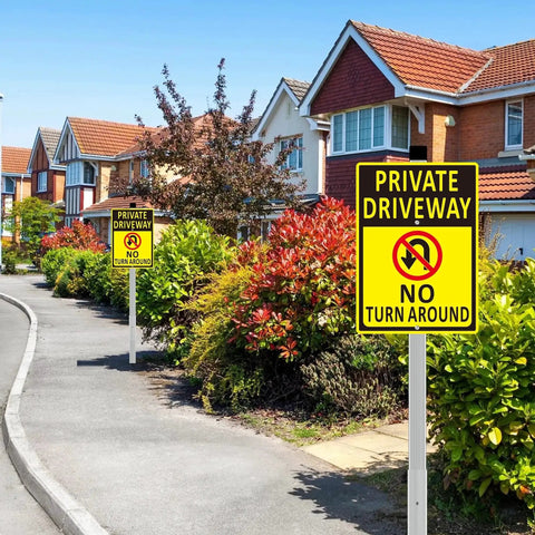 Front view of 2 Pack No Turn Around Driveway Sign 14x10 Inch Heavy Duty Aluminum Private Driveway Signs with long stakes installed in a residential area.