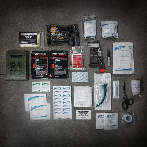 Advanced Outdoor Trauma Kit With CAT Gen 7 Tourniquet Mil Spec Nylon Pouch And 36 Inch Splint displayed on concrete surface