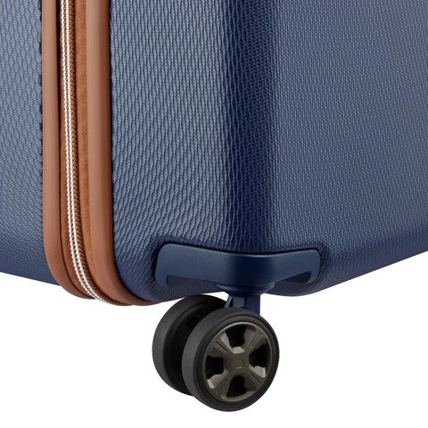 Close-up of Chatelet Air 2.0 Hardside Luggage Trunk With Spinner Wheels Navy Blue 26 Inch Durable Polycarbonate Shell.
