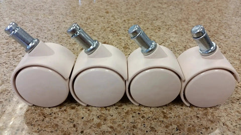 Almond Replacement Caster Set For Chromcraft Chairs Four Polyurethane Casters with One and Three Quarters Inch Wheels displayed on table