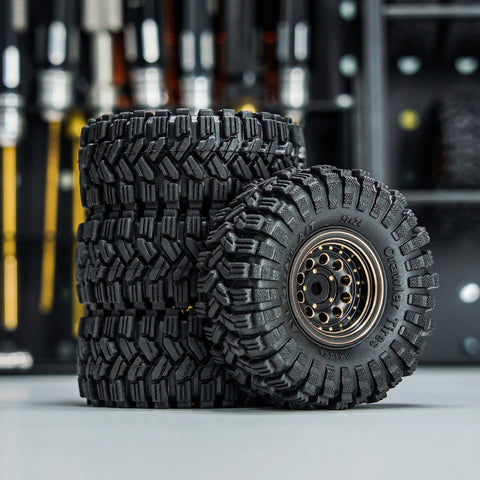 Brass Beadlock Wheel Set With Black Coating And S5 1.0 Crawler Tires For Axial SCX24 AX24 TRX4M FCX24 Upgrades shown stacked.