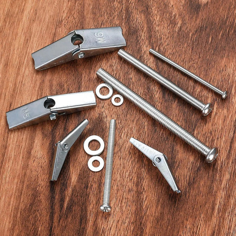 123 Piece Toggle Bolt And Wing Nut Kit For Hollow Walls Heavy Duty Drywall Anchors Set with carbon steel bolts on wood surface.