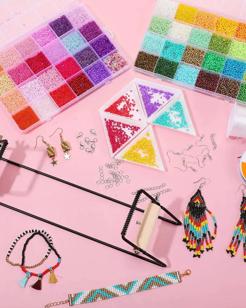 All In One Bead Loom Kit With 24000 Glass Seed Beads In 48 Colors For Adults Dope Jewelry Making Supplies For Bracelets Earrings And Christmas Gifts Diy Craft displayed on a pink background with accessories and finished jewelry pieces.