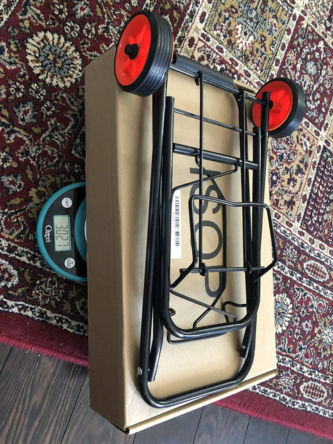 Foldable Lightweight Two Wheel Shopping Cart Dolly with easy open design on a box with red wheels, perfect for luggage transport.