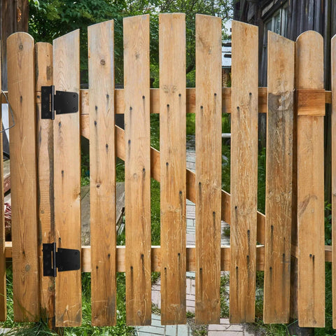 Wooden gate with 3.5 Inch Heavy Duty Gate Hinges 2 Pack Black Iron Extra Thick T Gate Hinges installed outdoors
