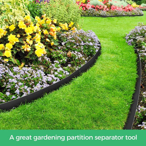 2 Inch Landscape Edging Border Kit With 100 Anchoring Spikes installed in a garden, separating flower bed and grass, black flexible edge