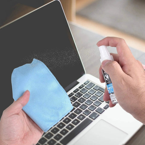 Using Lens And Screen Cleaning Kit With 3 Cleaning Sprays And 3 Microfiber Cloths on a laptop screen