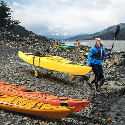 Person using Go-To Universal Kayak Carrier Trolley For Kayaks Canoes Paddleboards Float Mats And Jon Boats With 200-Pound Capacity
