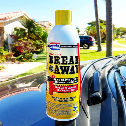 Breakaway Fast Penetrating Oil For Rusted Joints And Bolts, Heavy Duty Penetrant And Lubricant That Loosens Screws, Controls Rust And Squeaks, NSF H2 Certified, VOC Compliant In All 50 States, Pro Mechanic Grade bottle on car hood