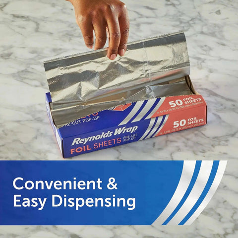 Hand pulling sheet from Reynolds Wrap box, No Fuss Pre Cut Pop Up Aluminum Foil Sheets 14 By 10.25 Inches Each Pack Of 5 50 Sheets Per Box.