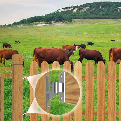 Heavy Duty Gate Hinges 304 Stainless Steel One Piece Five Eighth Inch Pin Two Pack Wall Mounted on a wooden fence at a farm.