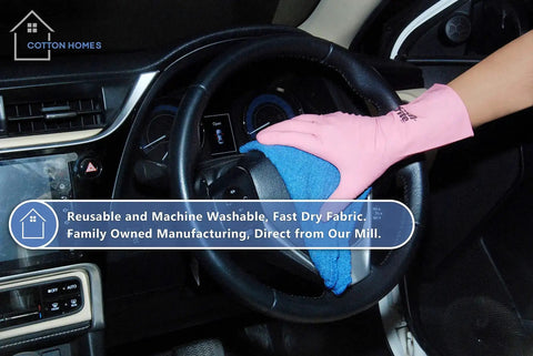 Hand in pink glove cleaning car steering wheel with Blue 12x14 Inch Shop Towels Pack Of 50 Plus 5 Bonus Reusable Cleaning Rags For Garage Auto Painting Kitchen Bar Tough As Nails 100 Percent Cotton Absorbent Towels Workhorse