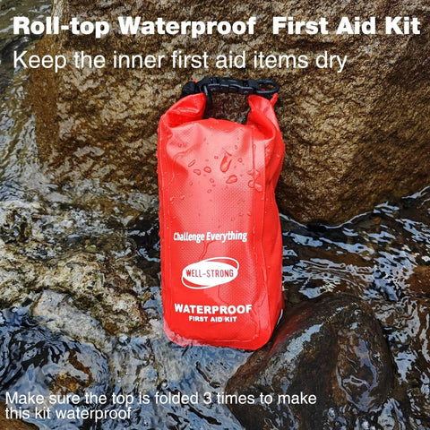 Waterproof Roll Top First Aid Kit For Boats And Outdoor Adventures in wet rocky area, red bag by Well Strong