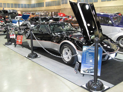 Plastic Barrier Chain 2 Inch Links UV Resistant 25 Feet Length HDPE used for display at a car show around a vintage car.