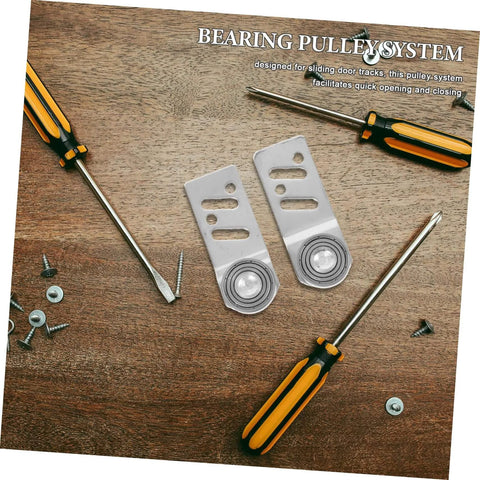 Beefy Stainless Steel Sliding Door Pulley Kit With Track Mounted Roller, two pulleys and tools on wooden surface for industrial use.