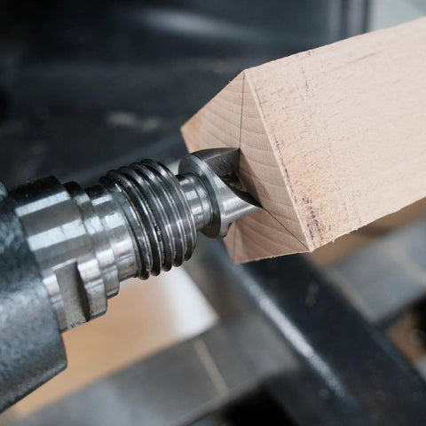 Close-up of Four Piece MT2 Woodturning Lathe Center Set with Live Center and Spur Centers holding wood on lathe.