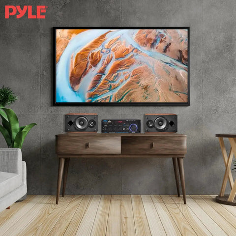 Beast 200W Peak Dual Channel Bluetooth Stereo Amplifier With LED Display and RCA USB SD MIC inputs on wooden table, wall-mounted TV