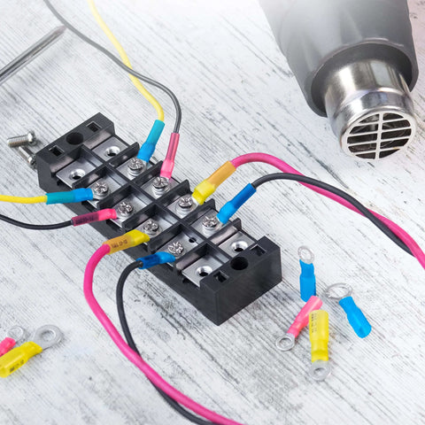All In One Heat Shrink Wire Connectors Kit For Marine And Auto Use with connectors and tubing on a wooden surface
