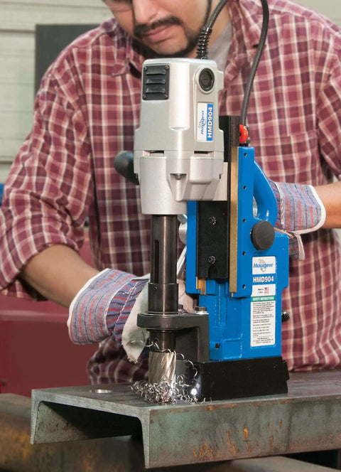 Heavy Duty Magnetic Drill For Fabrication With One And A Half Inch Capacity 115 Volt Power Lightweight Ergonomic Design LED Pilot Light And Lift Detector Safety System The Drill Of Choice For Tough Jobs Hougen HMD904 being used on metal