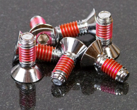 Pile of metal screws with red threadlocker, compatible with Pro Grade Torque Screwdriver With One Quarter Inch Drive Precise 10 To 70 Inch Pounds Adjustable Torque Laser Calibrated For Tightening And Loosening Small Screws Includes Threadlocker Tube.