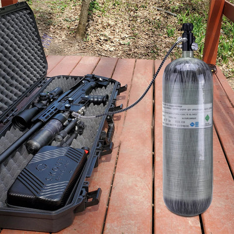 Paintball fill valve M18×1.5, 4500psi, 20in hose connected to scuba tank beside a foam-padded hard case with an airgun.