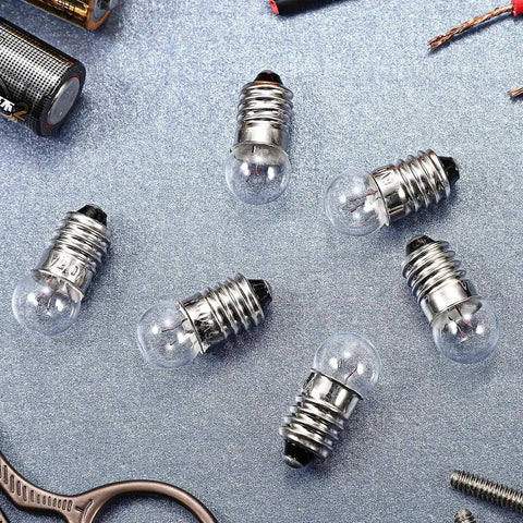 20 Pack E10 Mini Light Bulbs With E10 Screw Base, 1.5V 0.3A Tiny Replacement Lamps for DIY electrical experiments on a metallic surface.