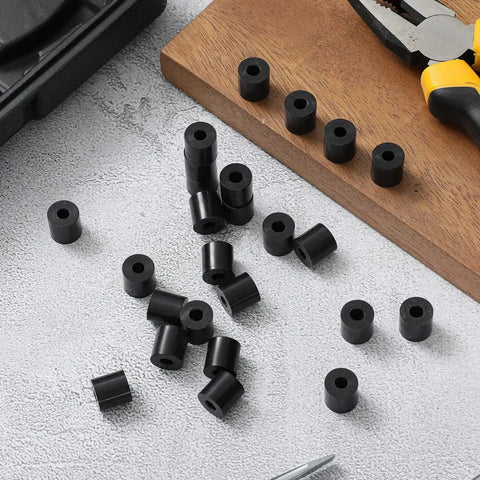 200 Pcs Black Nylon Spacers Half Inch Thick, Half Inch Outer Diameter, 0.194 Inch Inner Diameter displayed on a workbench