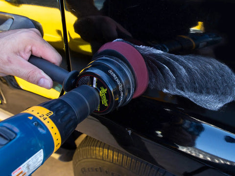 Close-up of Meguiars ScratchX 7 Oz Liquid for Car Scratch Fix That Kicks Out Paint Scratches and Swirls Without Messing Your Clear Coat in use with DA polisher.