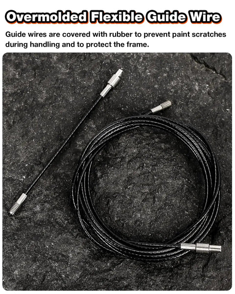 Internal bike cable routing kit: black flexible guide wire with metal ends, coiled on dark surface
