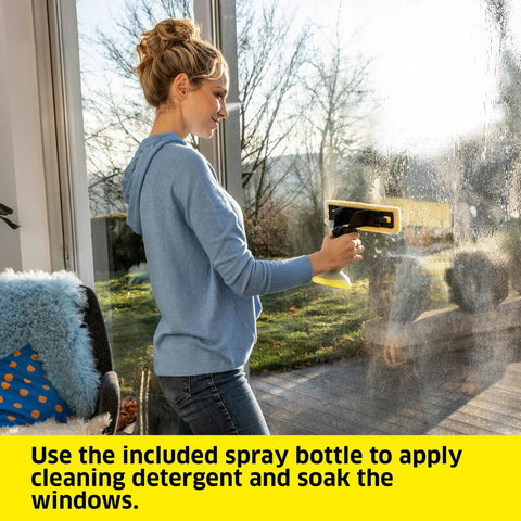 Kärcher WV 6 11-inch electric window vacuum squeegee used on glass by a person in a blue hoodie
