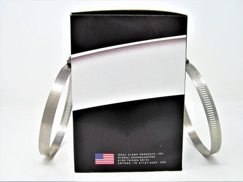 Two stainless steel exhaust hose clamps leaning against a black box with a white diagonal design.
