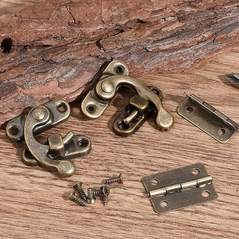 Antique bronze lock set with hinges, screws, and Vintage Style Mini Swing Arm Clasp Latch Set With Dope Bronze Hinges And Antique Box Latch Hasp Lock For Decorative Cabinets And Small Wooden Jewelry Boxes Or Gift Boxes Includes 80 Screws And 10 Hinges on wooden surface