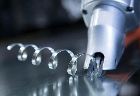 Close-up of Heavy-Duty Metal Shear cutting metal with swivel head, variable speed, 4-amp power, 360-degree swivel for precise pro-grade cuts.