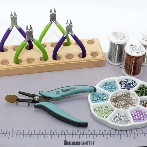 Metal Hole Punch Pliers with Gauge Guard for Clean 1.5mm Rivet Holes in Sheet Metal, displayed on crafting mat with beads and wires.