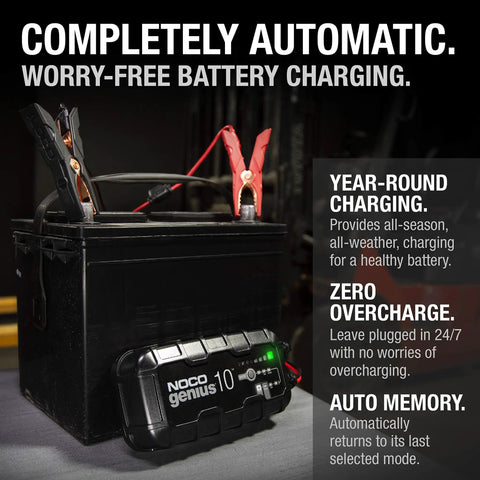 Genius10 All In One 6V 12V Smart Battery Charger And Maintainer For Lead Acid And Lithium By NOCO on a black battery with clamps.