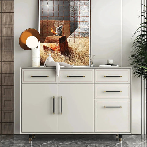 White dresser with brushed satin gold brass finish T bar cabinet handles set of 10 with electroplated matte black accents.