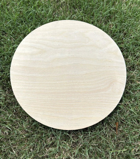 18 Inch Birch Wood Round Craft Blank 1/4 Inch Thick Plywood Circle For Signs Painting Laser Cutting And Diy Projects Great For Crafters And Makers Made In Usa Borowood shown flat on grass