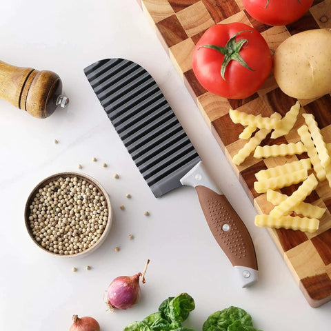 Crinkle Cutter Wave For Veggies And Fries With Stainless Steel Blade And Rubber Handle Dishwasher Safe Brown Perfect For French Fries Cucumbers Carrots Potatoes And More OLULU on cutting board with veggies and fries
