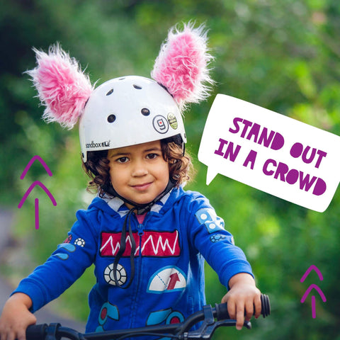 Child on bike wearing white helmet with pink fluffy lynx ears, Lynx Themed Helmet Ears Accessory Kit With Sticky Hook And Loop Fastener For Snowboarding Skiing And Biking Helmet Not Included Fluffy Bunny Rabbit Ears For Kids Toddlers And Adults To Stand Out On The Slopes.
