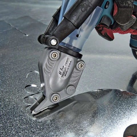 Close-up of Double Cut TurboShear Attachment for drills cutting sheet metal, showing clean edges with power-assisted 18 gauge capacity.