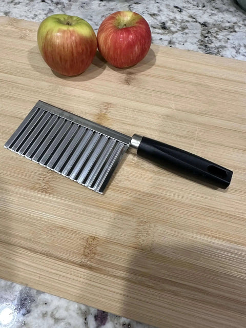 Crinkle Cut Wavy Blade Slicer For Fries And Veggies Stainless Steel French Fry Cutter Kitchen Vegetable Chopping Tool With Ergonomic Grip Rust Resistant Build A Game Changer For Everyday Home Chefs on a wooden cutting board