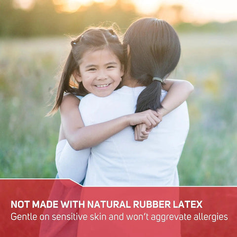 Child hugging adult outdoors, text: "Not made with natural rubber latex, gentle on sensitive skin" displayed at bottom.