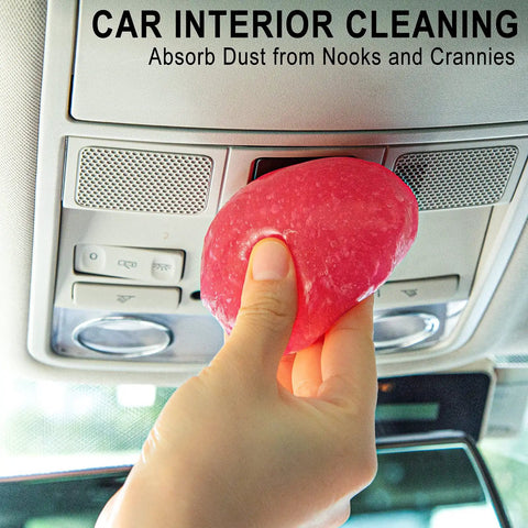 Close-up of hand using Car Cleaning Gel Detailing Putty For Auto Interiors And Grime Removal Dust Crumbs Pet Hair In Nooks And Crannies Easy To Use Rose Red 160g.