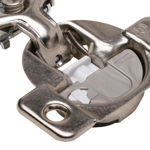 Close-up of a soft close cabinet hinge featuring a 45mm screw hole pattern, suitable for 1/2 inch overlay, made in USA.