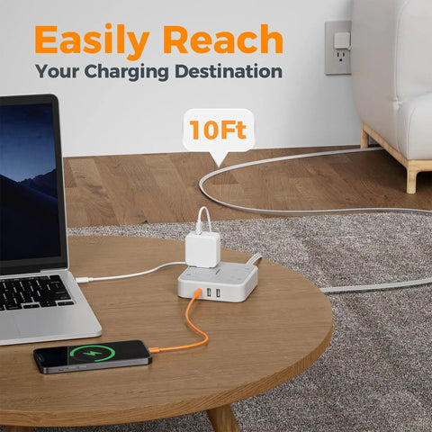 Extension Cord 10 Ft Long Surge Protector Power Strip With 4 Outlets 3 USB Ports Including USB C 900 Joules Protection Flat Cable For Home Office Dorm Room Desktop Charging Station Grey shown on a wooden table with devices charging.