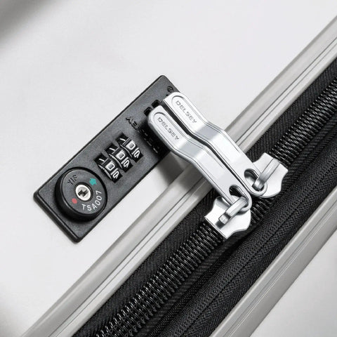 Close-up of lock on Lightweight Titanium Hardside Expandable Spinner Luggage With Scratch Resistant Matte Finish Delsey Paris Silver Medium