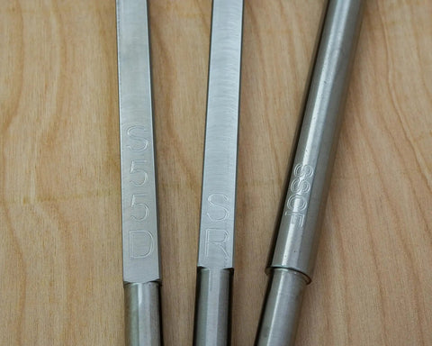 Close-up of Pack Of 3 Carbide Woodturning Tools Set With Rougher Detailer Finisher Full Size Shafts And Interchangeable Foam Grip Lathe Handle USA Made Stainless Steel For A Pro Grade Finish showing tool shafts.
