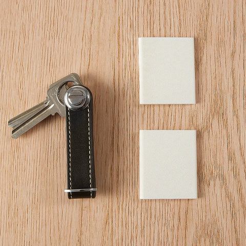 Easy Install Self Adhesive Door Corner Seals 8 Pack, Weather Stripping Draft Stopper For Doors shown beside keys on wood surface