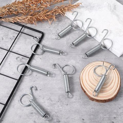 8 silver 20 Pack Spring Cage Latch Clips For Dog Crates Rabbits Cats Birds Parrots on gray surface with wood slice